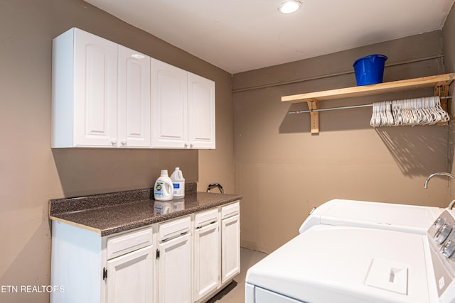 laundry area featuring washing machine and dryer, recessed lighting, and cabinet space