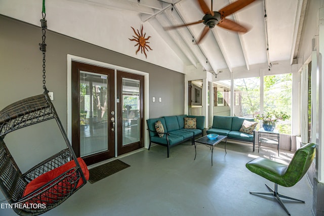 sunroom featuring beam ceiling, french doors, ceiling fan, and an outdoor living space