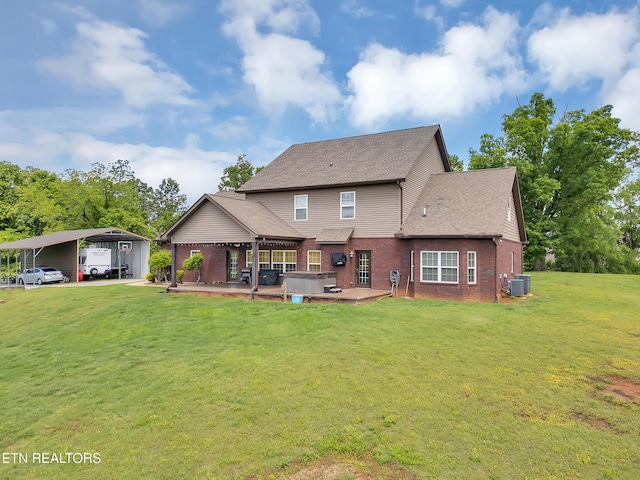 1810 Griffitts Mill Cir, Maryville, TN 37803 - rear view of property with a detached carport, central AC unit, a hot tub, a lawn, and brick siding