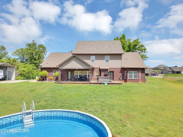 1810 Griffitts Mill Cir, Maryville, TN 37803 - back of property featuring brick siding, a yard, a patio, and a shingled roof