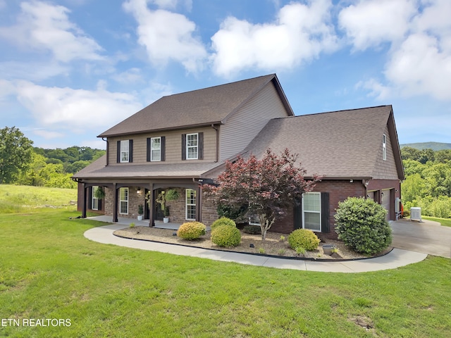 1810 Griffitts Mill Cir, Maryville, TN 37803 - craftsman-style home featuring a front yard, driveway, brick siding, a garage, and covered porch