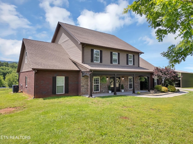 1810 Griffitts Mill Cir, Maryville, TN 37803 - view of front of property with cooling unit, a front lawn, a patio area, a shingled roof, and brick siding