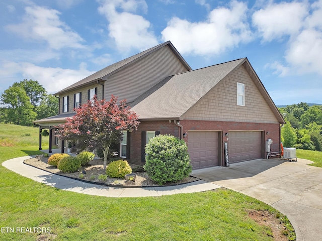 1810 Griffitts Mill Cir, Maryville, TN 37803 - view of side of home with a yard, driveway, brick siding, and a shingled roof