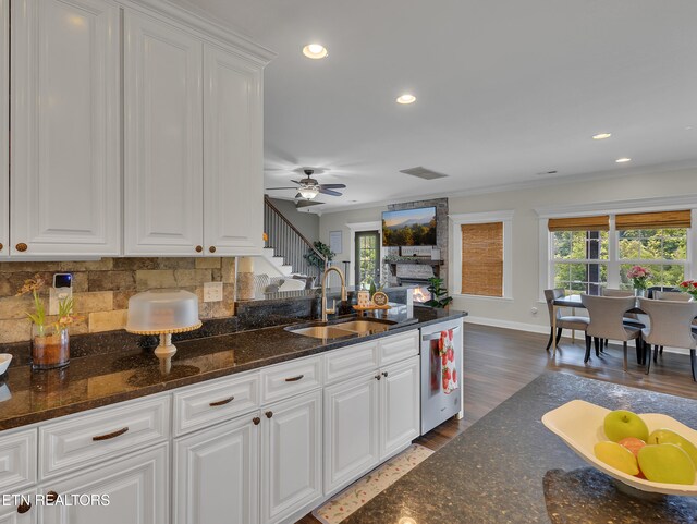1810 Griffitts Mill Cir, Maryville, TN 37803 - kitchen featuring a sink, stainless steel dishwasher, white cabinets, decorative backsplash, and baseboards