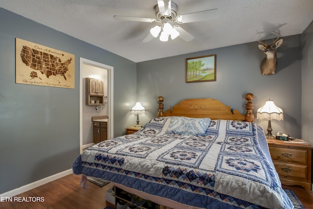 325 Correll Ridge Rd, Decatur, TN 37322 - bedroom with wood finished floors, a textured ceiling, baseboards, ensuite bath, and a ceiling fan