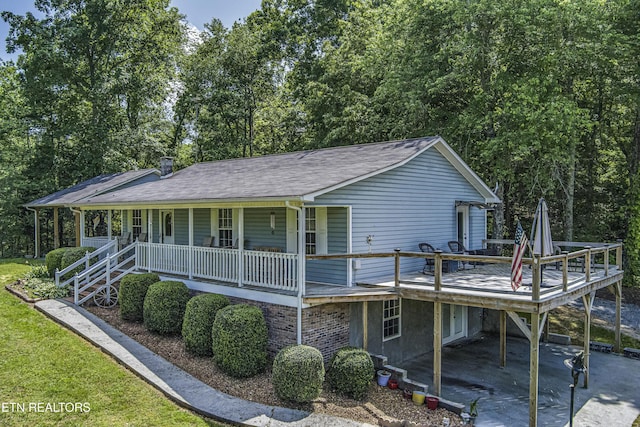 325 Correll Ridge Rd, Decatur, TN 37322 - view of front of property featuring a porch, a carport, and roof with shingles
