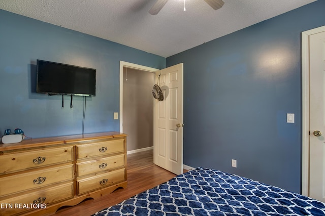 325 Correll Ridge Rd, Decatur, TN 37322 - bedroom with wood finished floors, a textured ceiling, ceiling fan, and baseboards