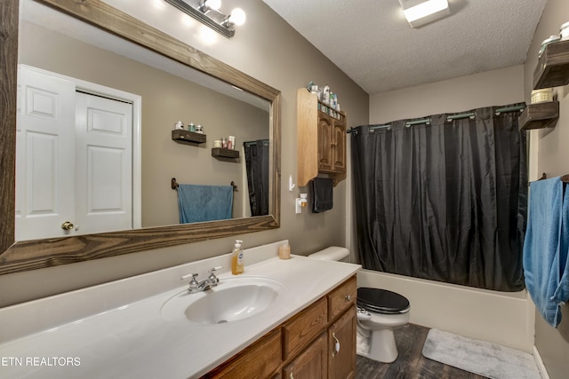 325 Correll Ridge Rd, Decatur, TN 37322 - bathroom featuring wood finished floors, a textured ceiling, toilet, vanity, and shower / tub combo
