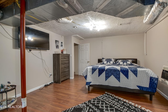 325 Correll Ridge Rd, Decatur, TN 37322 - bedroom featuring wood finished floors, heating unit, and baseboards