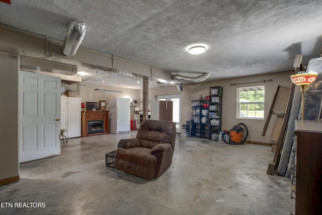 325 Correll Ridge Rd, Decatur, TN 37322 - below grade area featuring freestanding refrigerator, baseboards, and a fireplace