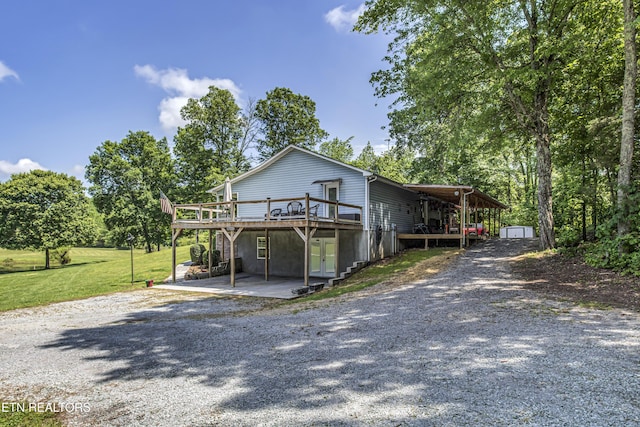 325 Correll Ridge Rd, Decatur, TN 37322 - view of front of home with a wooden deck, driveway, a patio, a front lawn, and french doors