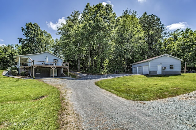 325 Correll Ridge Rd, Decatur, TN 37322 - view of front of home with gravel driveway, a deck, a front lawn, and a detached garage