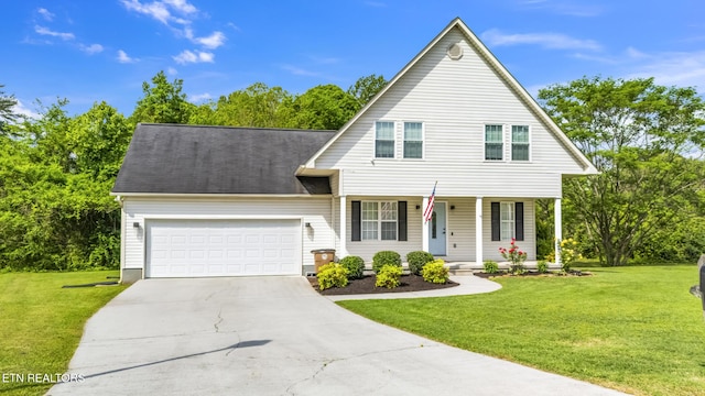 view of front facade featuring a front lawn, driveway, a porch, and a garage