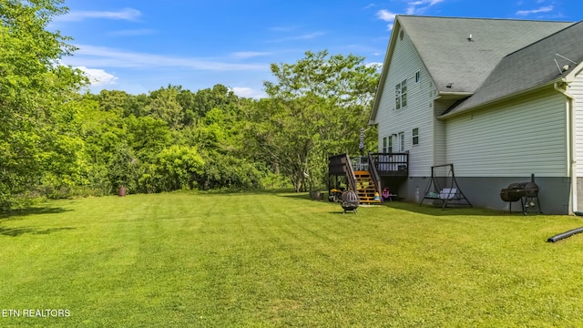 view of yard featuring stairway and a wooden deck