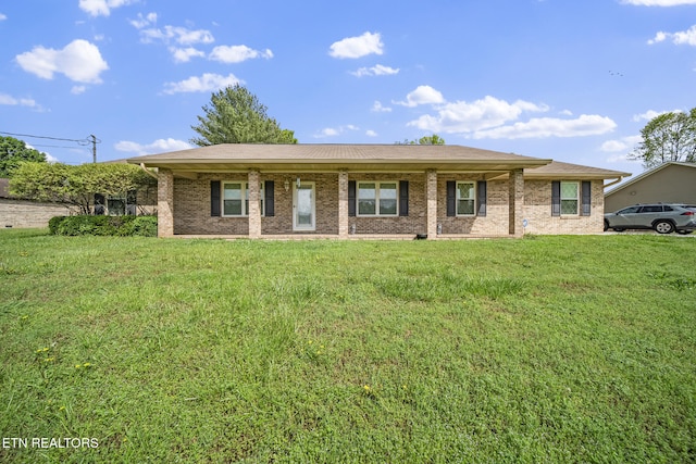 ranch-style home with brick siding and a front yard