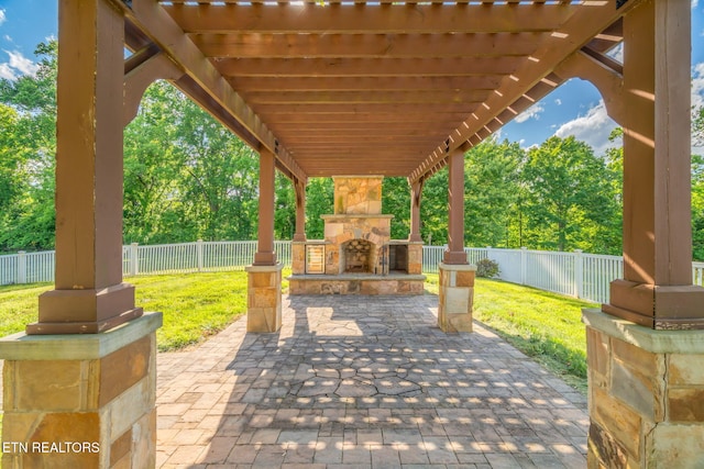 205 Melea Ln, Kingston, TN 37763 - view of patio with an outdoor stone fireplace, a pergola, and view of scattered trees