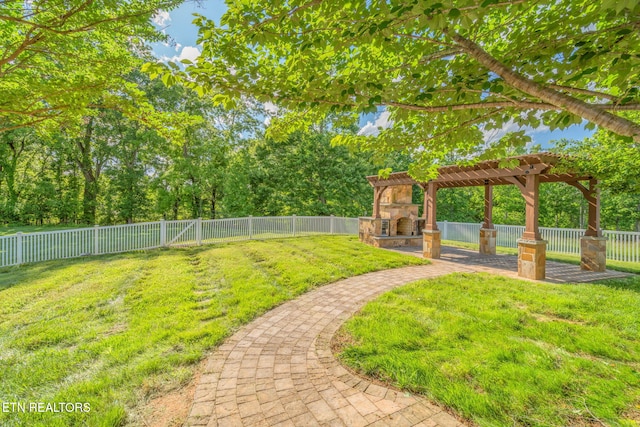 205 Melea Ln, Kingston, TN 37763 - view of yard featuring an outdoor stone fireplace, a pergola, and a patio
