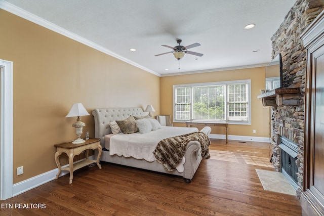 205 Melea Ln, Kingston, TN 37763 - bedroom featuring crown molding, a stone fireplace, baseboards, wood finished floors, and a ceiling fan