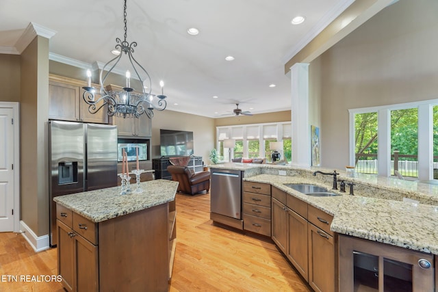205 Melea Ln, Kingston, TN 37763 - kitchen with appliances with stainless steel finishes, a sink, ornamental molding, ceiling fan, and a kitchen island