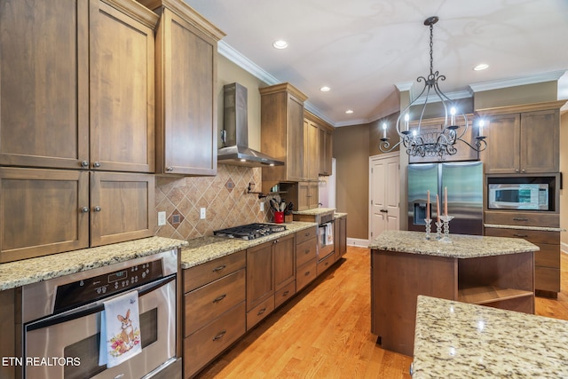 205 Melea Ln, Kingston, TN 37763 - kitchen with appliances with stainless steel finishes, wall chimney exhaust hood, ornamental molding, a chandelier, and decorative backsplash