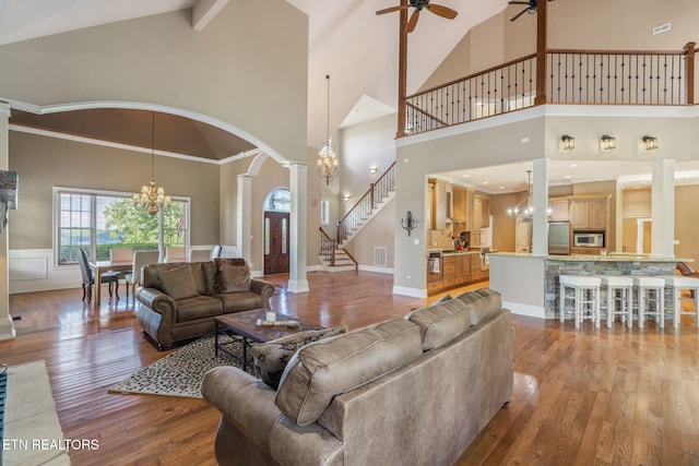 205 Melea Ln, Kingston, TN 37763 - living area featuring high vaulted ceiling, a ceiling fan, a chandelier, stairway, and light wood-style floors