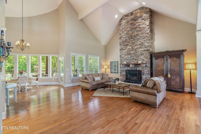 205 Melea Ln, Kingston, TN 37763 - living area featuring a chandelier, high vaulted ceiling, light wood-style flooring, a fireplace, and baseboards
