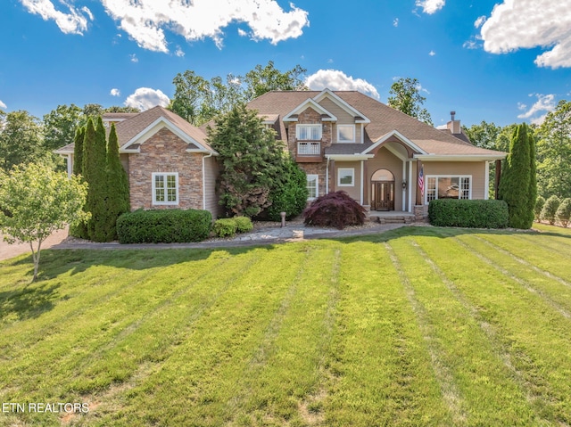 205 Melea Ln, Kingston, TN 37763 - view of front of property featuring a front yard, a chimney, and stone siding