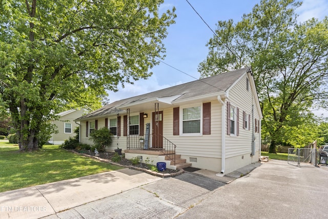 view of front of house with a front lawn and crawl space