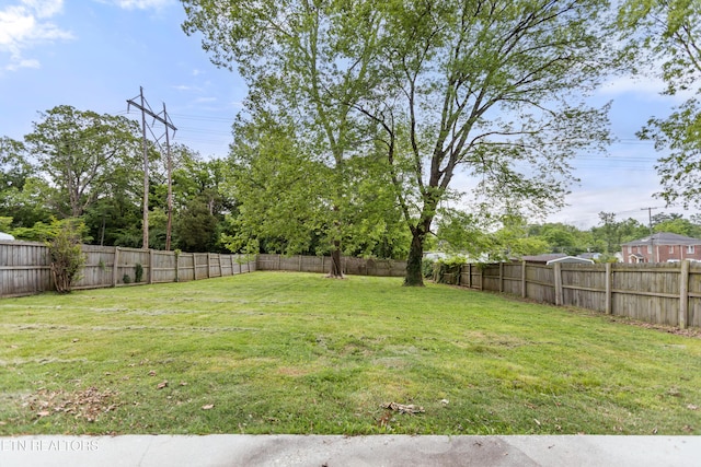 view of yard with a fenced backyard
