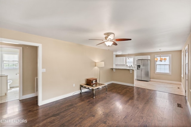 living area with light wood finished floors, plenty of natural light, and visible vents
