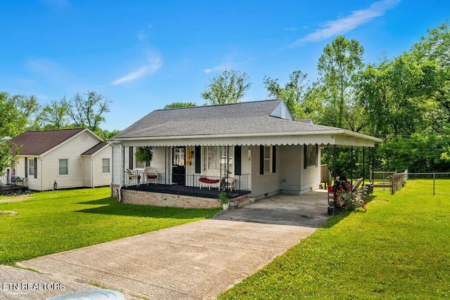 farmhouse with covered porch, fence, a shingled roof, a front yard, and driveway