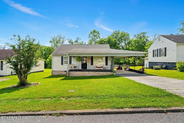 bungalow-style home with a porch, concrete driveway, a front lawn, and an attached carport