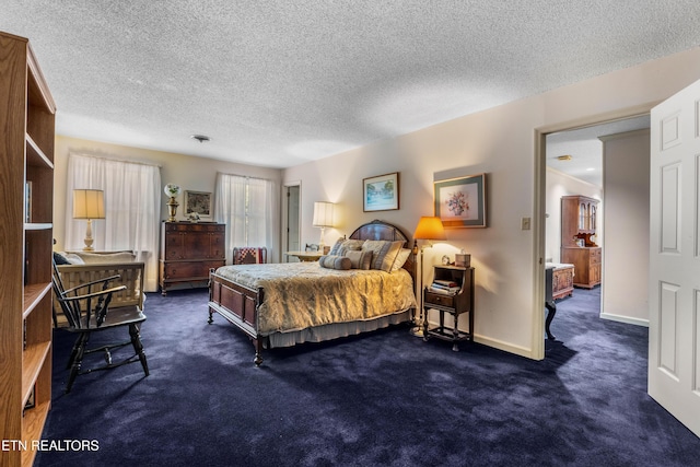 carpeted bedroom with a textured ceiling and baseboards