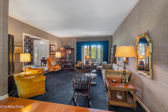 living room featuring crown molding and baseboards