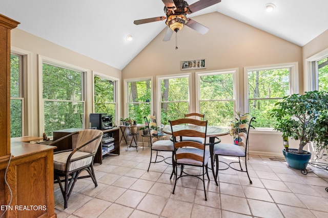 sunroom featuring tile patterned flooring, high vaulted ceiling, and recessed lighting