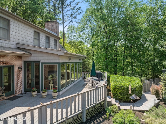 deck featuring french doors and outdoor dining area