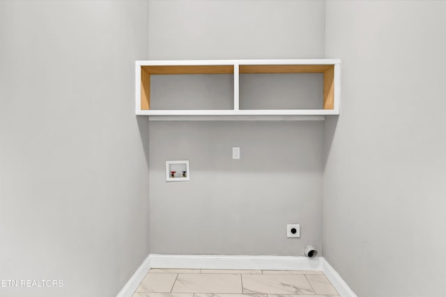 clothes washing area featuring baseboards, marble finish floor, hookup for a washing machine, laundry area, and electric dryer hookup