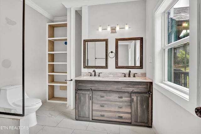 full bath with a sink, ornamental molding, toilet, and marble finish floor