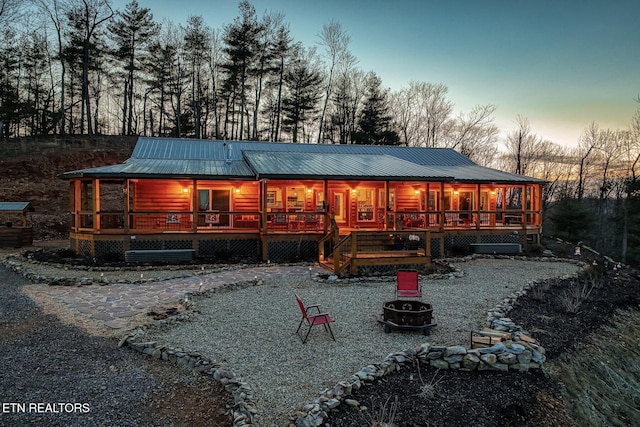 1898 Kennedy Way, Del Rio, TN 37727 - back of property with an outdoor fire pit and metal roof