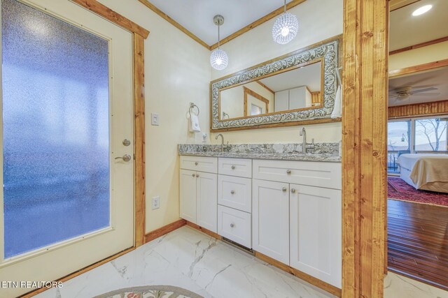 1898 Kennedy Way, Del Rio, TN 37727 - ensuite bathroom with marble finish flooring, double vanity, ceiling fan, ornamental molding, and baseboards