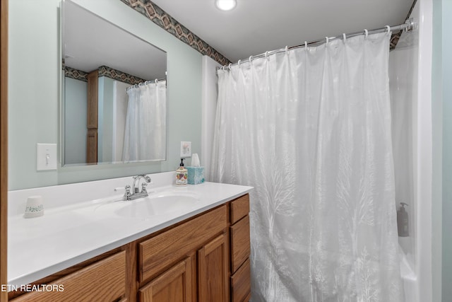 full bathroom featuring vanity and a shower with shower curtain