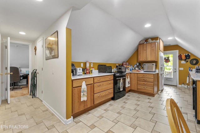 kitchen featuring white refrigerator with ice dispenser, black range with electric cooktop, light countertops, baseboards, and lofted ceiling