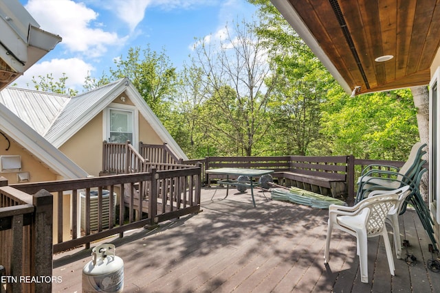wooden deck with central AC unit