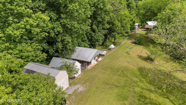 view of subject property with a heavily wooded area