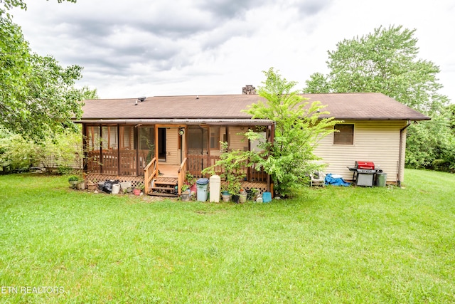 375 Rainbow Rd, Sevierville, TN 37862 - back of house with a lawn, a sunroom, and a shingled roof
