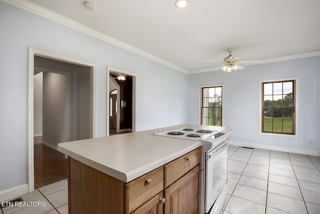 2000 Robinson Dr, Lenoir City, TN 37772 - kitchen featuring electric range, light tile patterned floors, ceiling fan, ornamental molding, and baseboards
