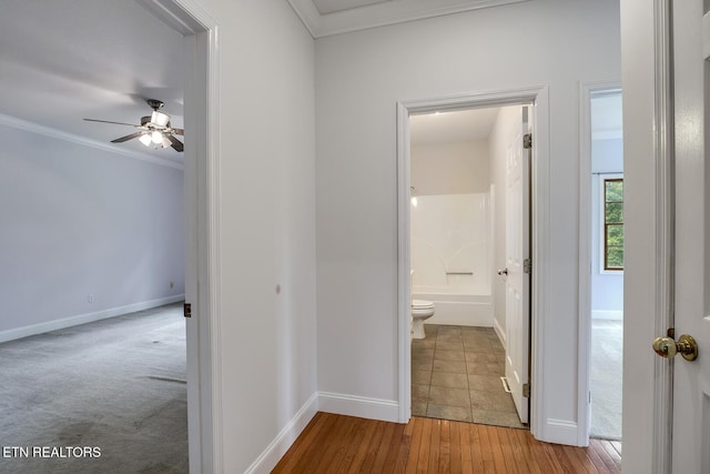 2000 Robinson Dr, Lenoir City, TN 37772 - hallway featuring crown molding, baseboards, and wood finished floors