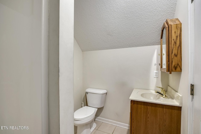 2000 Robinson Dr, Lenoir City, TN 37772 - bathroom with tile patterned floors, toilet, vanity, vaulted ceiling, and baseboards