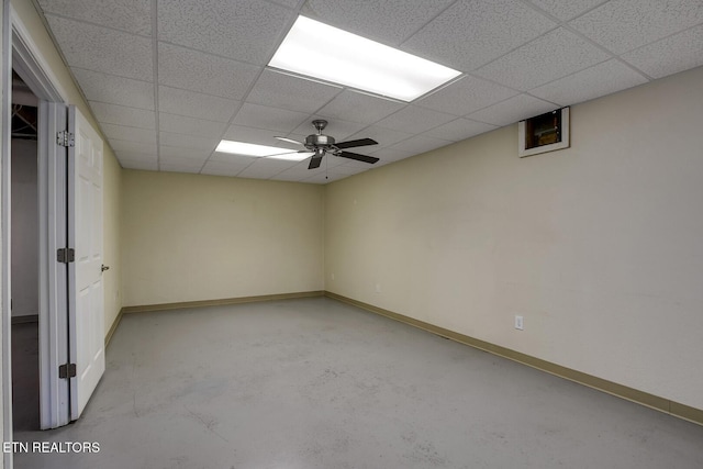 2000 Robinson Dr, Lenoir City, TN 37772 - unfurnished bedroom with concrete flooring, baseboards, a paneled ceiling, and ceiling fan