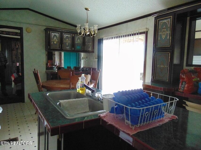 309 Elizabeth Russell Ln, Speedwell, TN 37870 - dining room featuring crown molding, light floors, a textured ceiling, a chandelier, and lofted ceiling